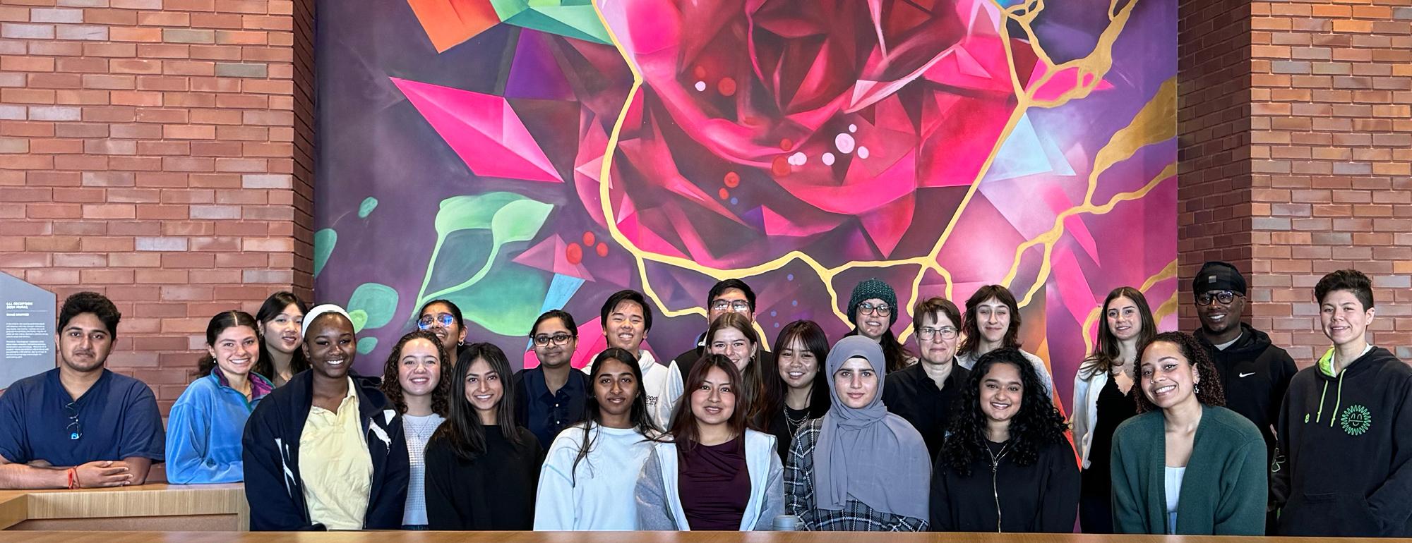 QAS students in front of painting 
