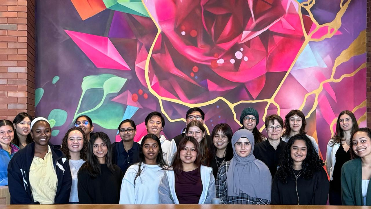 QAS students in front of painting