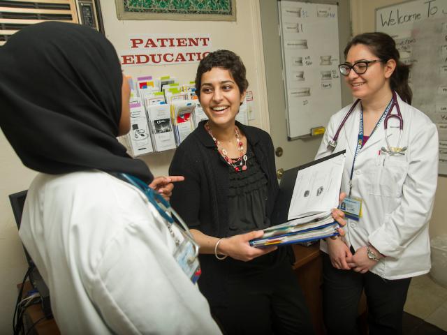 Student with medical interns at Shifa Clinic