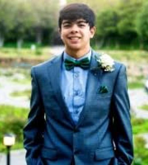 Diego Cerna wearing a tuxedo, in the gardens of Alameda.