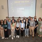 A group of people posing for a photo. Group is primarily UC Davis students. 