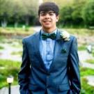 Diego Cerna wearing a tuxedo, in the gardens of Alameda.