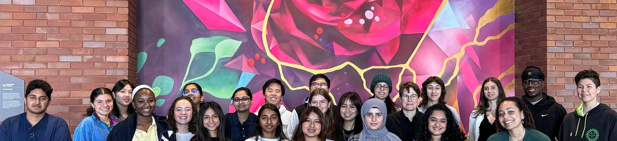 QAS students in front of painting 